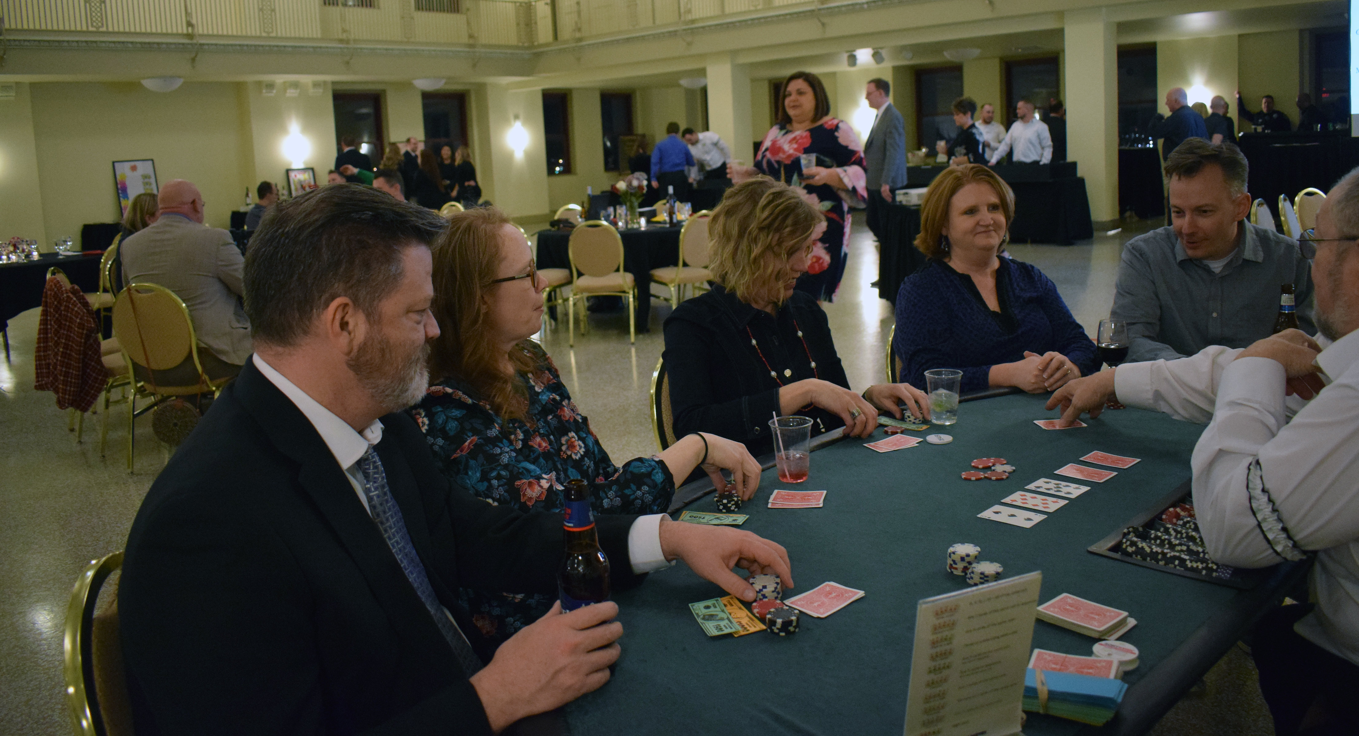 Guests enjoy the casino tables at the Omaha Law League Casino Night at the Livestock Exchange Building on March 6, 2020. (Photo by Elizabeth A. Elliott)