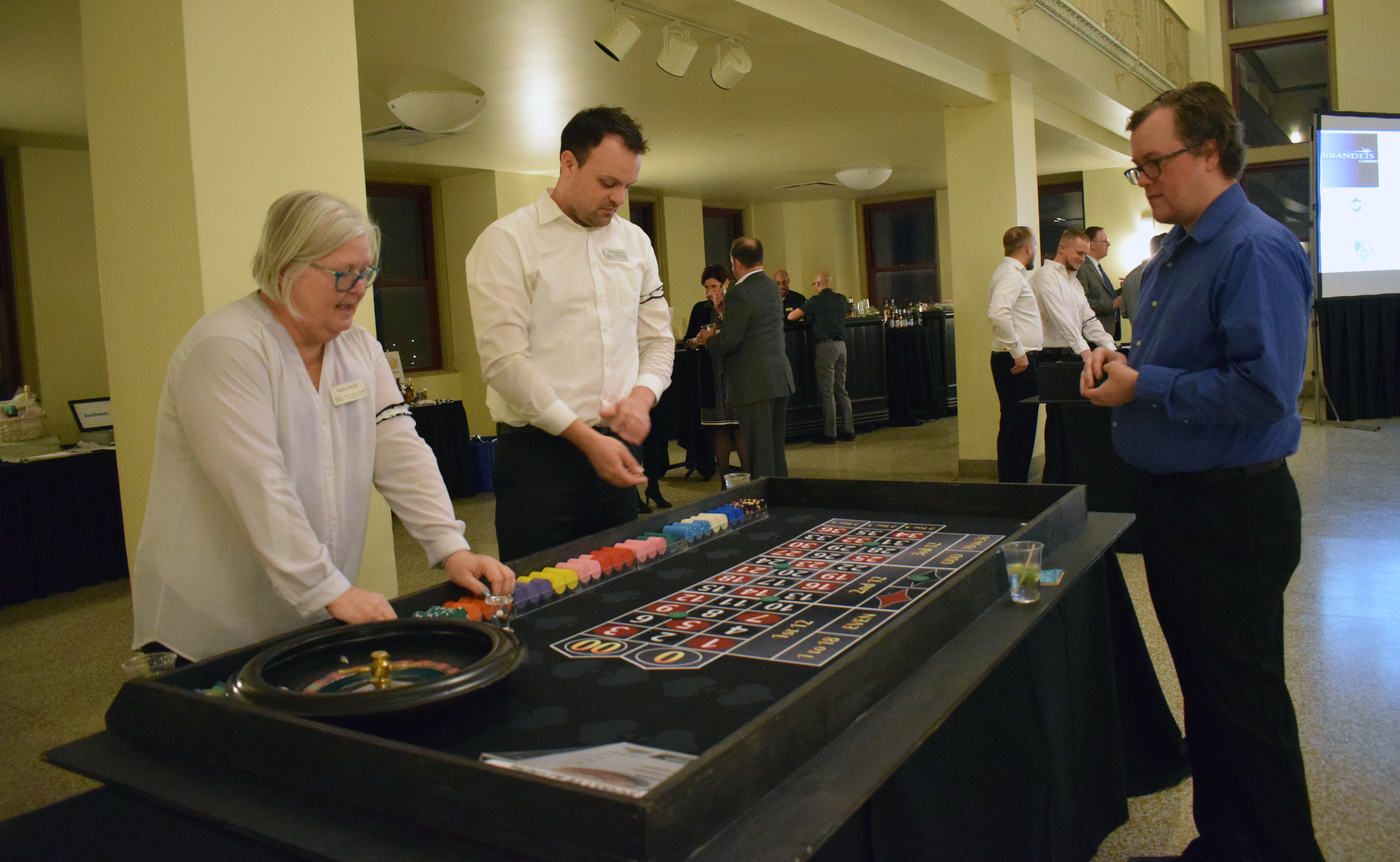 David Sund tries his hand at roulette at the Omaha Law League Casino Night at the Livestock Exchange Building on March 6, 2020. (Photo by Elizabeth A. Elliott)