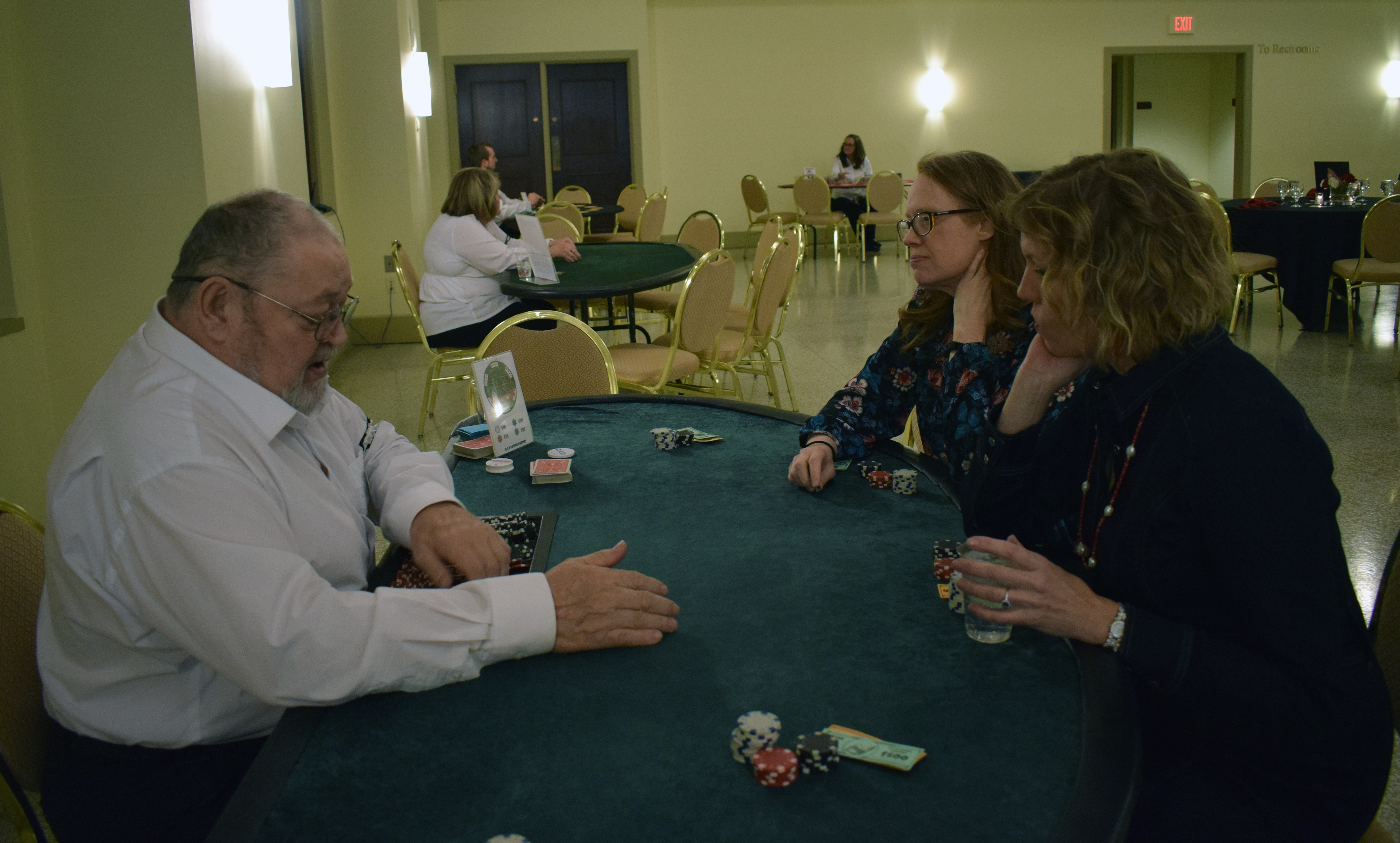 Guests learn how to play various casino games at the Omaha Law League Casino Night at the Livestock Exchange Building on March 6, 2020. (Photo by Elizabeth A. Elliott)