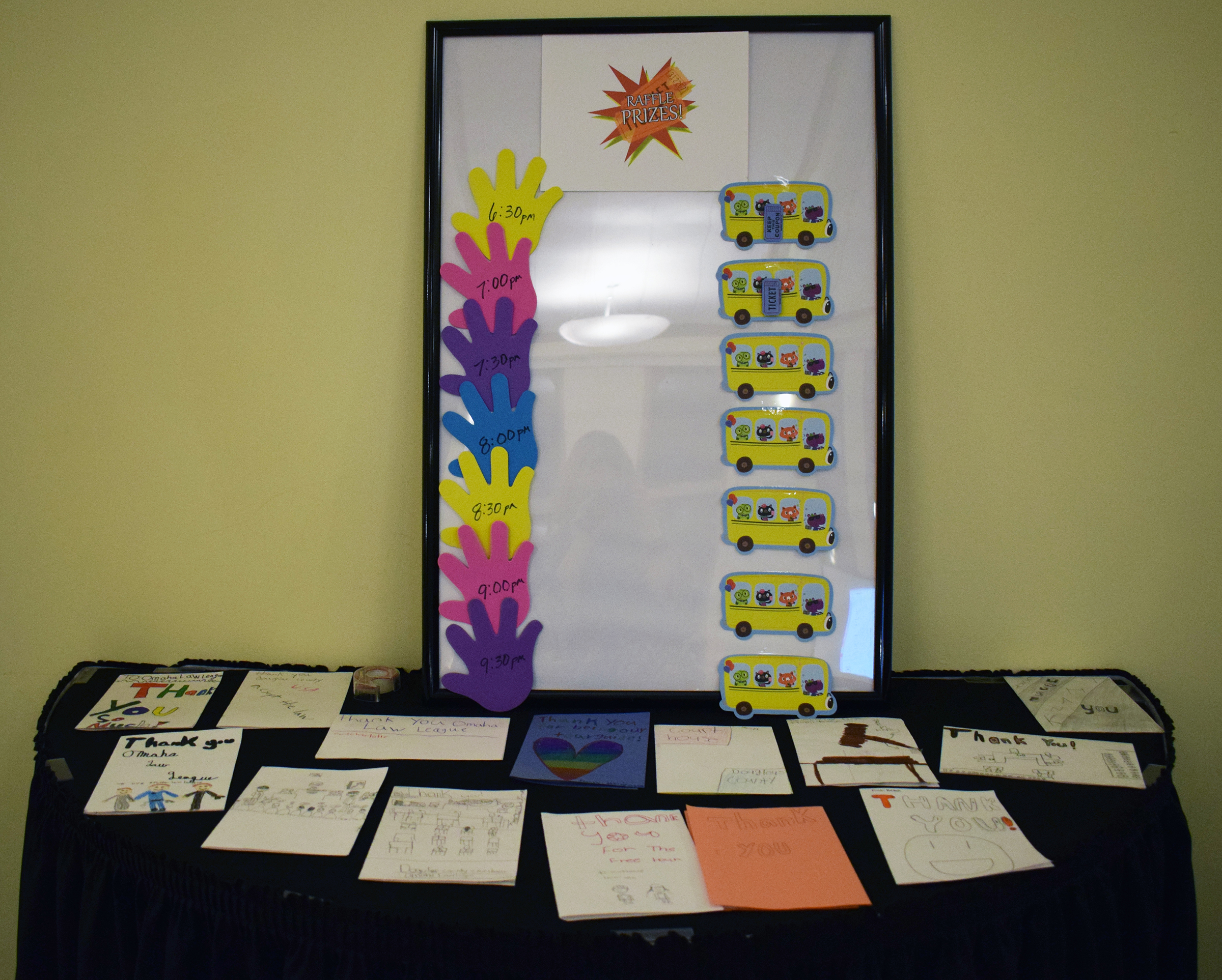 A table of thank you notes from students are on display at the Omaha Law League Casino Night at the Livestock Exchange Building on March 6, 2020. (Photo by Elizabeth A. Elliott)
