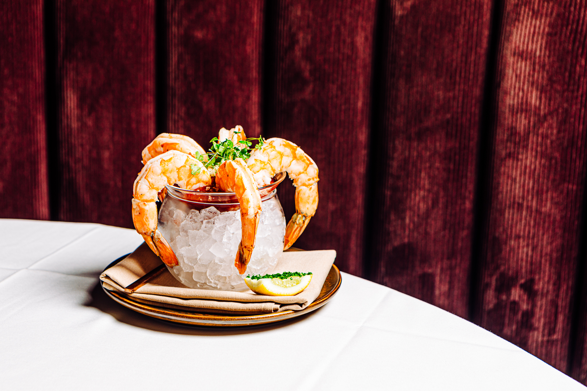 The colossal shrimp cocktail comes with five cold shrimp in a bowl of ice topped with a house-made lemongrass cocktail sauce and fresh horseradish.<br />(Joshua Foo / Flatwater Free Press)