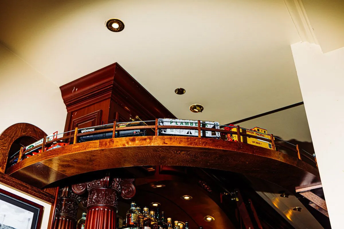 Omaha is the only 801 location with a miniature train track running above the bar.<br />(Joshua Foo / Flatwater Free Press)