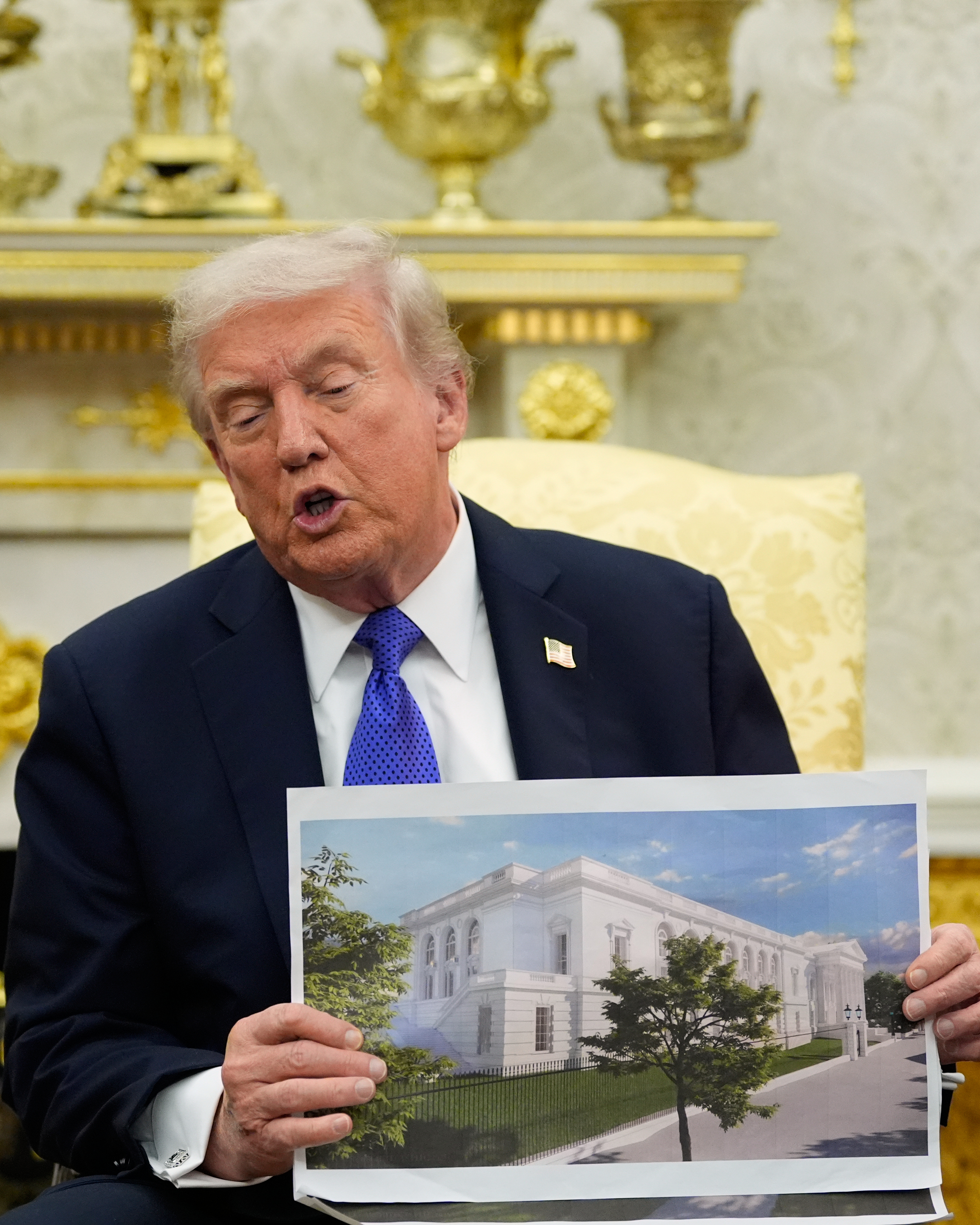 President Donald Trump holds an artist&#039;s rendering of the new White House ballroom in the Oval Office on Oct. 22.<br />(Alex Brandon / AP Photo)