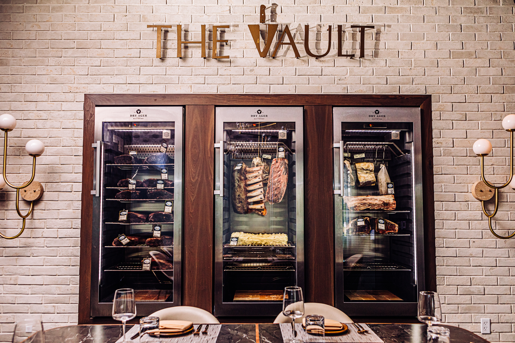 The Vault, inside one of the restaurant’s private dining rooms, showcases an array of dry-aged meat that the restaurant will serve as part of special menu items in the coming months.<br />(Joshua Foo / Flatwater Free Press)