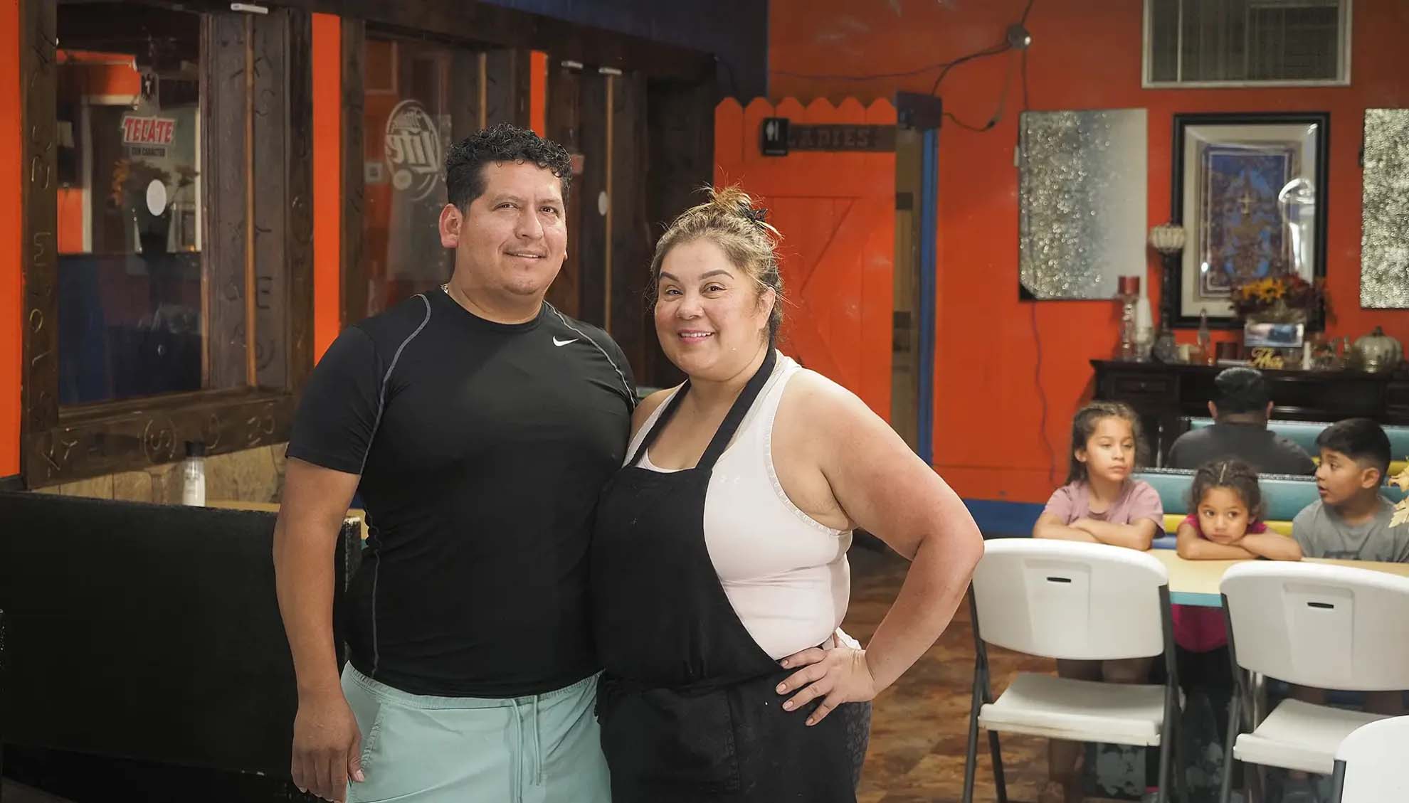 Rosa Brambila and Eliso Lopez stand in La Michoacana Restaurant and Lounge, the Mexican restaurant they own and operate in Wakefield. Behind them are several of Rosa’s grandchildren.<br />(Jerry L Mennenga / Flatwater Free Press)