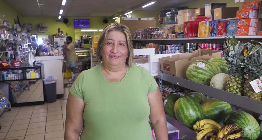 Maria Catalan, the owner of Tienda Mexicana Guerrero, stands inside her grocery store in Wakefield. The Mexican grocery store is the town’s only grocery store, and the lone spot to get fresh produce. Catalan has owned the store for for 24 years, allowing her and other family members to leave manufacturing jobs and put down stakes in Wakefield.<br /> (Jerry L Mennenga / Flatwater Free Press)