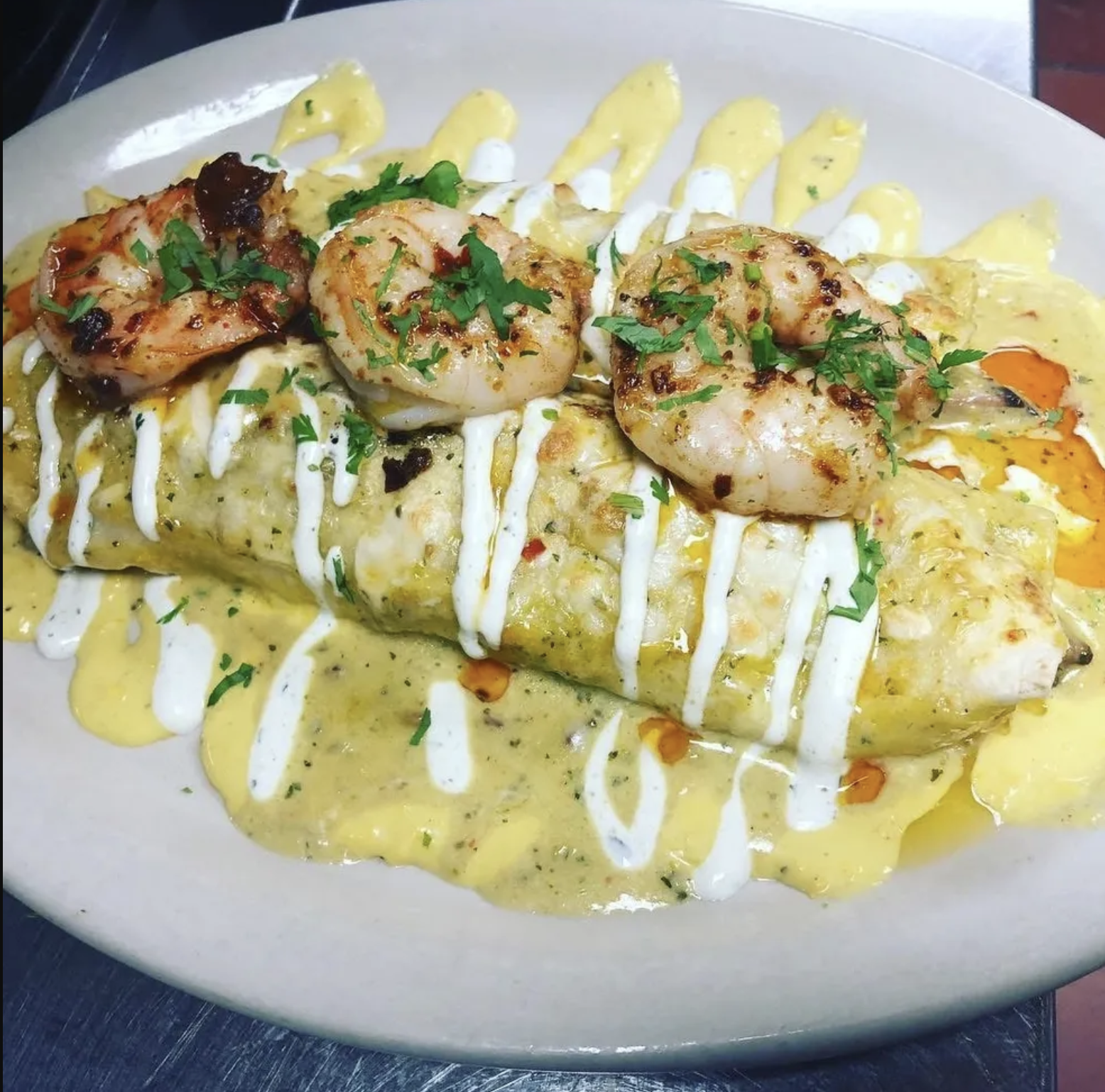 An Oaxacan white mole enchilada is topped with a lighter version of mole often reserved for special celebrations.<br />(Courtesy photo)