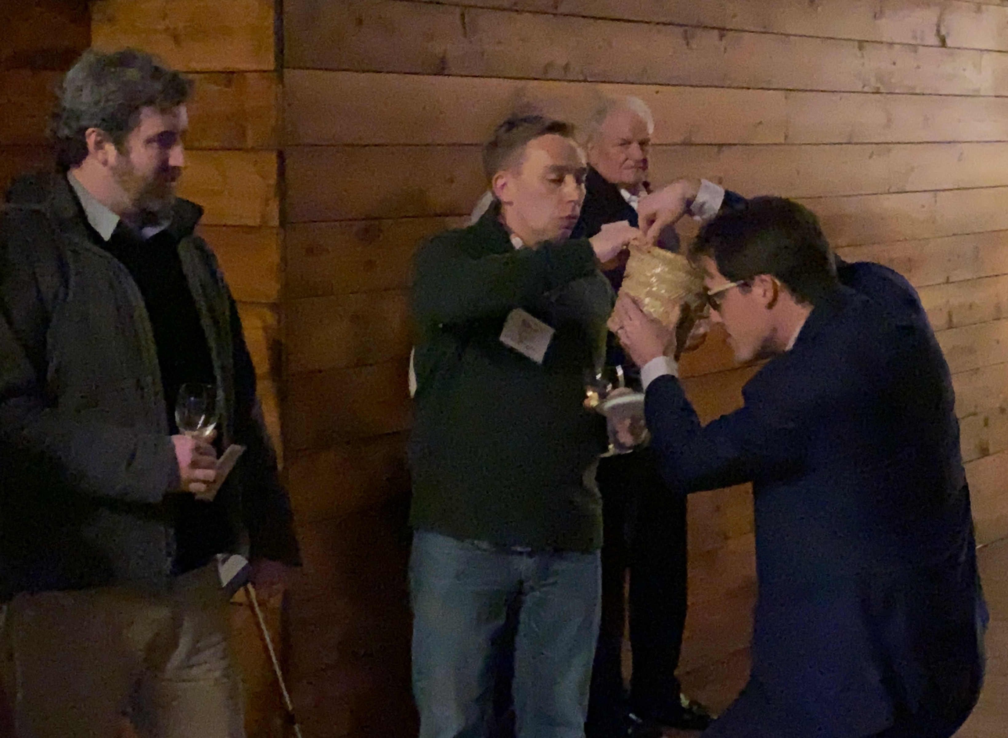 Omaha Bar Association Executive Director Dave Sommers selects the winner of a raffle prize at the OBA Wine Tasting event Friday, Jan. 24, 2020. (Photo by Scott Stewart)