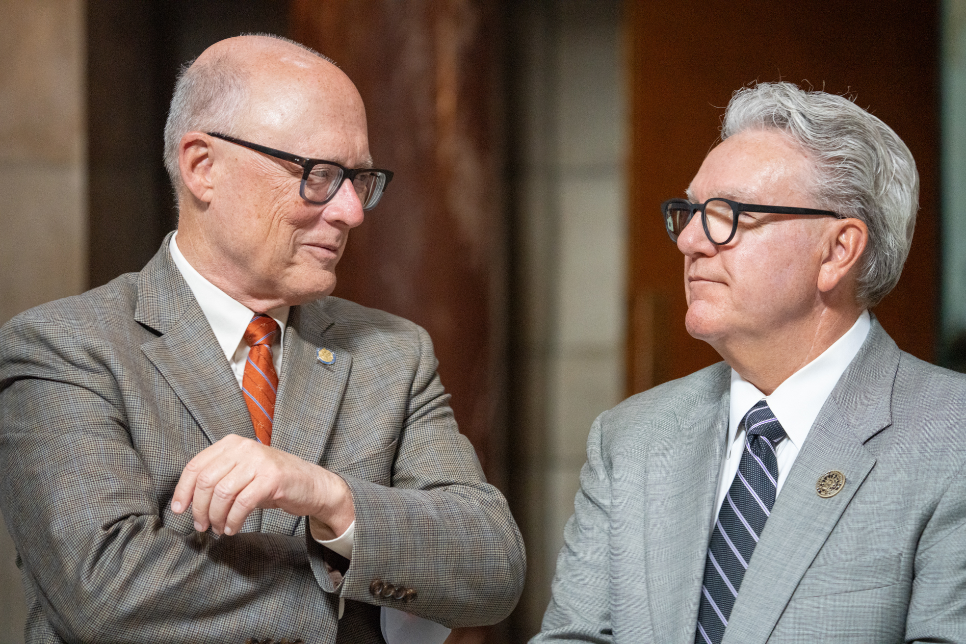 Speaker of the Nebraska Legislature John Arch (left) talks with former Speaker Jim Scheer of Norfolk. Scheer now serves on the University of Nebraska Board of Regents, June 6, 2025.<br />(Zach Wendling / Nebraska Examiner)