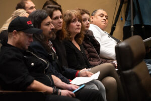 Scott Newgent, Mario Present, Luka Hein, Erin Brewer, Cat Cattinson and Atoa Vaiaso listen to fellow supporters of State Sen. Kathleen Kauth’s bill on Wednesday, Feb. 8, 2023, in Lincoln, Neb. (Zach Wendling / Nebraska Examiner)
