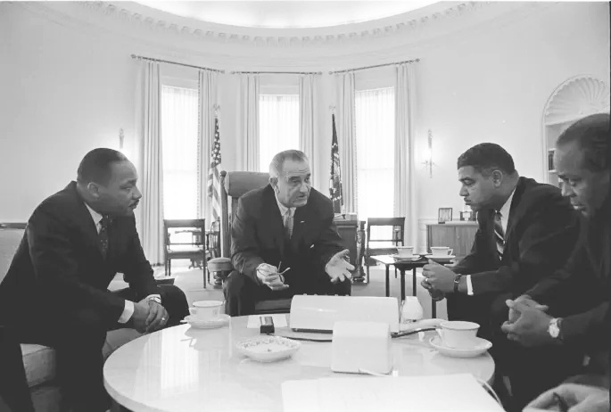 President Lyndon B. Johnson meets with Civil Rights leaders including Martin Luther King. Jr., January 18, 1964. (Lyndon B. Johnson Presidential Library, National Archives)