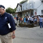 Federal Emergency Management Agency administrator W. Craig Fugate talks on the telephone Wednesday, Aug. 31, 2011, in Paterson, New Jersey.
(Mel Evans / AP Photo)