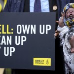 Activists hold 'Ecocide Babe' that has simulated crude oil congealed around its mouth highlighting the public health impact of environmental devastation caused by Shell in Nigeria, outside The Royal Courts of Justice, ahead of the Ogale and Bille communities versus Shell court case in London, Thursday, Feb. 13, 2025. 
(Kirsty Wigglesworth / AP Photo)