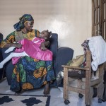 Fatoumata Sané holds her daughter Aissata, 8, who suffers from a rare genetic disease, at their home in Dakar, Senegal, Saturday, Jan. 11, 2025. 
(Annika Hammerschlag / AP Photo)