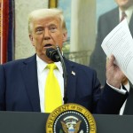 President Donald Trump holds a document with notes about Kilmar Abrego Garcia as he speaks with reporters in the Oval Office of the White House, April 18, 2025, in Washington.
(Alex Brandon / AP Photo)