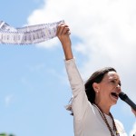 Opposition leader Maria Corina Machado holds up tally sheets during a protest against the reelection of President Nicolás Maduro one month after the disputed presidential vote which she says the opposition won by a landslide, in Caracas, Venezuela, Aug. 28, 2024. 
(Ariana Cubillos / AP Photo)
