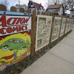 Oversized Superman comic book pages displayed on a fence outside of what was once Joe Shuster's boyhood home in Cleveland. Superman collaborators Jerry Siegel and Shuster lived several blocks apart in the Glenville neighborhood which shaped their lives, dreams for the future and their imagery of the Man of Steel. 
(Tony Dejak / AP Photo)