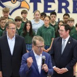 Nebraska Gov. Jim Pillen talking in front of U.S. Reps. Adrian Smith and Mike Flood at St. Teresa Catholic School in Lincoln on Sep. 29, 2025. 
(Juan Salinas II / Nebraska Examiner)