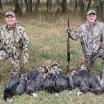 U.S. Sen. Pete Ricketts (at left) then Nebraska’s governor, celebrates his hunt near Chadron in 2022 with State Sen. Myron Dorn of Adams. Ricketts has now bought land in the area. 
(Courtesy of Nebraska Governor’s Office)