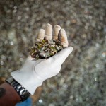 The glass, ground up in a sand-like texture, can be mixed with asphalt and concrete for road construction, according to Nathan Lund with the city. 
(Abiola Kosoko / Flatwater Free Press)