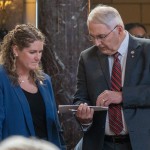 State Sen. Rob Clements of Elmwood (right)talks with State Sen. Carolyn Bosn of Lincoln on the floor of the Nebraska Legislature on Feb. 27, 2024. 
(Zach Wendling / Nebraska Examiner)