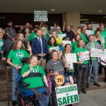 Advocates for medical cannabis join together before a public hearing at the Nebraska State Office Building in Lincoln, Nebraska, on state-drafted regulations for the new medicine approved by Nebraska voters in November 2024, Oct. 15, 2025. 
(Zach Wendling / Nebraska Examiner)