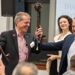 Nebraska Gov. Jim Pillen (left) is honored for his support of the Ukrainian people at an appreciation event at the House of Prayer in north Lincoln, Nebraska. Lead pastor Oleg Stepanyuk (right) gifted Pillen a bulava, a ceremonial mace that is a traditional symbol of authority for military and government leaders in Ukraine, Nov. 7, 2025. 
(Zach Wendling / Nebraska Examiner)