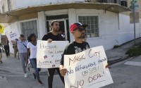 Residents of Miami’s Little Haiti have been fighting plans for a luxury development for several years. (Lynne Sladky / AP Photo)