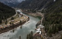 A train sits derailed near Quinn’s Hot Springs Resort west of St. Regis, Mont., Sunday, April 2, 2023. (Ben Allan Smith / The Missoulian via AP)