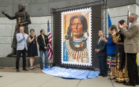 The Chief Standing Bear stamp is being unveiled by attendees from left, UNL journalism professor Joe Starita, Lincoln Parks and Recreation director Maggie Stuckey-Ross, Steve Laravie Jr., a descendant of Standing Bear, USPS Board of Governors vice chairman Anton Hajjar, Ponca tribal chairwoman Candace Schmidt, Nebraska Indian Affairs executive director Judi M. gaiashkibos, Friday, May 12, 2023, in Lincoln, Neb. Art director Derry Noyes designed the stamp.
(Justin Wan / Lincoln Journal Star via AP)
