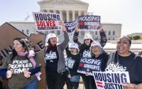 Activists demonstrate at the Supreme Court as the justices consider a challenge to rulings that found punishing people for sleeping outside when shelter space is lacking amounts to unconstitutional cruel and unusual punishment, on Capitol Hill in Washington, Monday, April 22, 2024. 
(J. Scott Applewhite / AP Photo)
