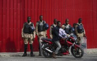 Police stand guard outside the Prime Minister's office in Port-au-Prince, Haiti, Thursday, April 25, 2024. A transitional council tasked with selecting a new prime minister and cabinet is expected to be sworn in on Thursday. 
(Ramon Espinosa / AP Photo)