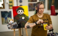 Ukrainian Anastasiya Sereda paints a canvas in an art class for women bereaved by war, in Kyiv, Ukraine, Sunday, April 28, 2024. 
(Francisco Seco / AP Photo)
