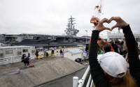 Family members and friends of the crew of the U.S. navy aircraft carriers USS Ronald Reagan (CVN-76) see off at the U.S. navy's Yokosuka base Thursday, May 16, 2024, in Yokosuka, south of Tokyo. This is the ship's final departure from Yokosuka before transiting back to the United States. 
(Eugene Hoshiko / AP Photo)