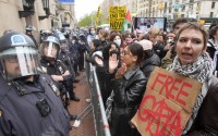 Police stand guard as demonstrators chant slogans outside the Columbia University campus, on April 18, 2024, in New York. The student-run legal journal, Columbia Law Review, was taken offline Monday, June 3, 2024, after its board of directors objected to the publication of an article that accused Israel of genocide. 
(Mary Altaffer / AP Photo)