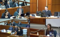In this image taken from a video provided by Idaho Fourth District Court, Rebecca Vincen-Brown (lower right) tears up as she testifies in court about her abortion, Tuesday, Nov. 12, 2024, in Boise, Idaho. 
(Idaho Fourth District Court via AP)