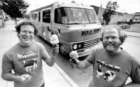 Jerry Greenfield (left) and Bennett Cohen (right), the founders of Ben and Jerry Homemade Inc., pose in front of their "Cowmobile" in Burlington, Vt., on June 15, 1987. 
(Toby Talbot / AP Photo)