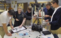 Franni Trivette and Brennan Ward solder the wiring on a 3-D printer they and other students are building from a kit in the pre-engineering class at Notre Dame High School in Wichita Falls, Texas, Monday, Sept. 28, 2015. The project is teaching the students about following instructions, hardware, assembly, troubleshooting and problem solving. 
(Torin Halsey / Wichita Falls Times Record News via AP)