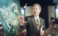 Bob Weis of the Walt Disney Company’s Imagineering Department, points to an artist rendering of the proposed Disney’s America theme park during a news conference in Manassas, Virginia, Nov. 11, 1993. The Disney company announced, it will build the theme park where visitors would relive great moments of history on a site in the rolling hills of the Civil War battlefield community. 
(J. Scott Applewhite / AP Photo)