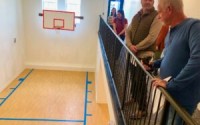 A basketball court was restored as a feature in the Lofts on Main historic renovation project. While people have been shooting around some, it is not supposed to be for actual basketball play, officials said, and likely will be a community social spot with, perhaps, a coffee bar. 
(Cindy Gonzalez / Nebraska Examiner)