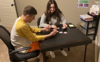 Max Perry of Lincoln, challenged by autism spectrum disorder and epilepsy, plays a memory game as part of applied behavior analysis therapy. His mom, Nikki Perry, says the game helps with social interaction, rules, coping with loss, celebrating wins and more. Nebraska officials have cut Medicaid reimbursement rates to providers as costs soar, saying they want to be more aligned with other states. 
(Courtesy of Perry family)