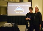 Kathy Knickrehm, right, receives a service award for her dedication to the Omaha Law League from Douglas County Court Judge Marcela Keim at the OLL Casino Night at the Livestock Exchange Building on March 6, 2020. (Photo by Elizabeth A. Elliott)