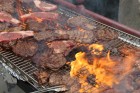 Steaks cook on the grill at Hanscom Park during the Barristers’ Club Steak Fry, Thursday, July 15, 2021. (David Golbitz/Daily Record)