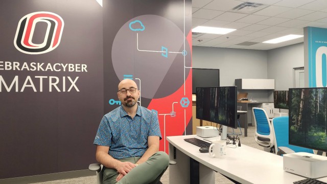 Matt Hale, director of the School of Interdisciplinary Informatics at the University of Nebraska-Omaha, created the MATRIX cyber center, a NASA-style control center that monitors potential cyberattacks at local companies. 
(Tim Trudell / The Daily Record)