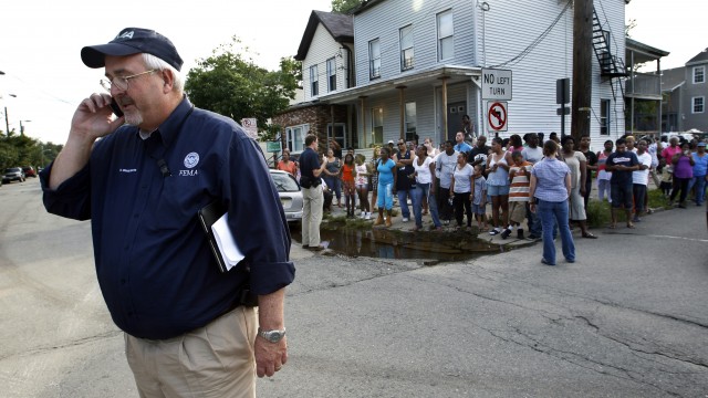 Federal Emergency Management Agency administrator W. Craig Fugate talks on the telephone Wednesday, Aug. 31, 2011, in Paterson, New Jersey.
(Mel Evans / AP Photo)
