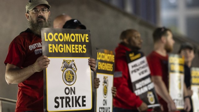 Union members from the Brotherhood of Locomotive Engineers and Trainmen form a picket line outside the NJ Transit Headquarters on Friday, May 16, 2025 in Newark, New Jersey. 
(Stefan Jeremiah / AP Photo)
