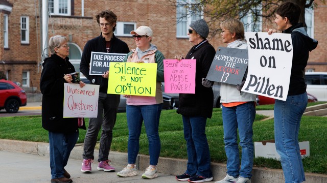A group of demonstrators against using the McCook Work Ethic Camp prison as a federal detention center, hold signs outside the Red Willow County Courthouse in McCook, Neb., on Friday, Oct. 24, 2025.
(Nikos Frazier / Omaha World-Herald via AP)