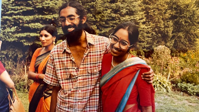 Subramanyam and Saraswathi Vedam embrace during their parents' wedding anniversary party at State College, Pa., in August 1981. 
(Saraswathi Vedam via AP)