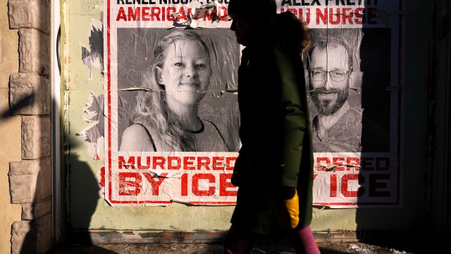 A woman walks by posters of Renee Good and Alex Pretti during a solidarity bike ride for Pretti, Saturday, Jan. 31, 2026, in Minneapolis.
 (Julia Demaree Nikhinson / AP Photo)