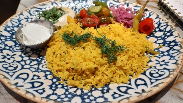 A plate of rice and pickled vegetables from Clio in the Old Market off 12th and Howard streets.
(Austin Petak / The Daily Record)